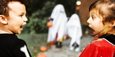 Kids being spooked on halloween night.