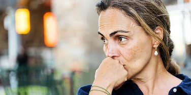 Woman deep in thought, having emotional affair.