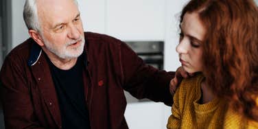 Father speaking to adult daughter.