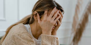 Sad woman suffers with post-romantic stress disorder.