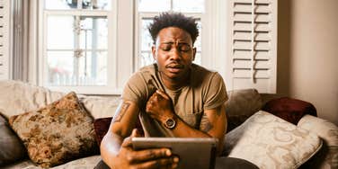Man sitting with himself, thinking about a painful, uncomfortable thought.