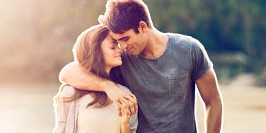 Couple in love, unaware of their brain changes, in a field