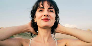 Empowered happy woman embracing life.