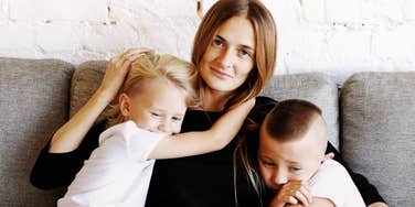 Mother parenting her children through their emotions.