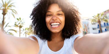 Intelligent woman handling her worries with a smile. 
