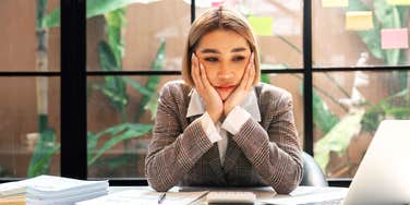 Woman sick at work.
