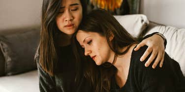 Best friend comforting friend in pain after divorce. 