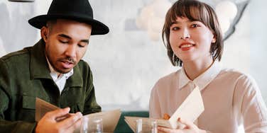 Impressed woman meeting a man with high IQ.