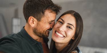 Happy couple smiling and hugging