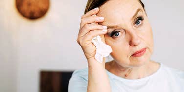 Sad female going through the stages of grief, after a divorce. 