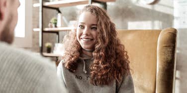 Young woman being strong and smart in an office setting with skills learned as a kid