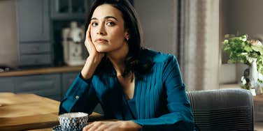 Woman thinking about forgiving cheating partner.