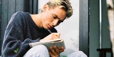 Man writing a love letter.