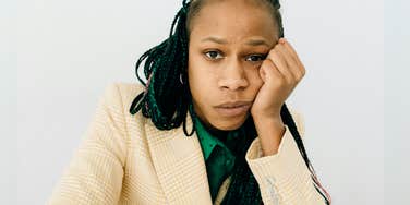 Miserable woman realizing she needs to leave job.
