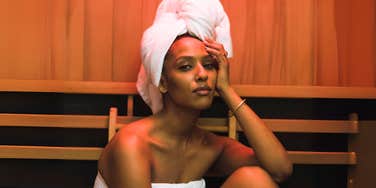 Woman in sauna daily for hear brain health. 