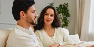 Couple making plans for future, listening to each other intently.