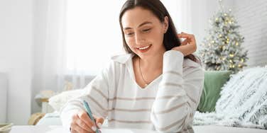 Gen Z woman letter writing