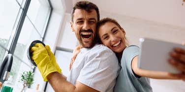 Happy couple following housework rules to stop fighitng about chores