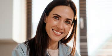 woman smiling wanting to be important