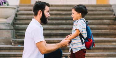 Millennial parenting his child. 