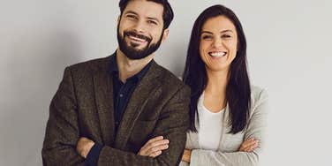 Brunette man and woman learning to trust after uncomfortable conversations