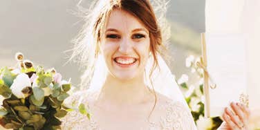 Brunette Gen Z bride smiles after rejecting Gen X wedding tradition