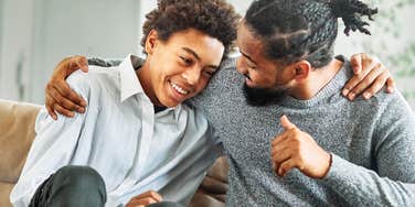 Grateful son hugging his father. 