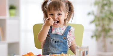 kid who is better at making friends because she eats seafood
