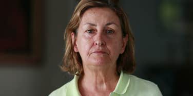 serious older woman looking at camera