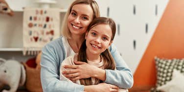 mom hugging resilient daughter