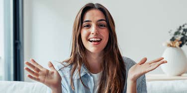 respected woman smiling with hand gestures
