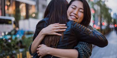 woman selfless personality traits hugging