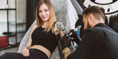 Tattoo artist covering up offensive art