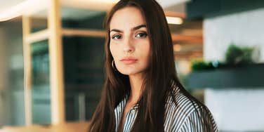 Woman who looks less experienced. 