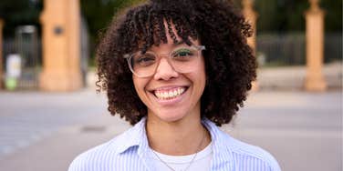 Gen Z woman smiling big