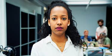 Woman not sharing at work because she's eyeing a promotion.