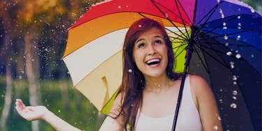 happy woman discovering spiritual meaning rain birthday