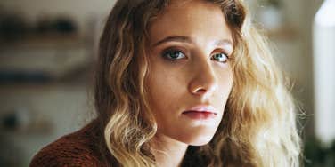 sad woman thinking about bad childhood experiences