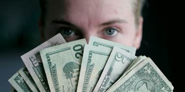 Person talks money.