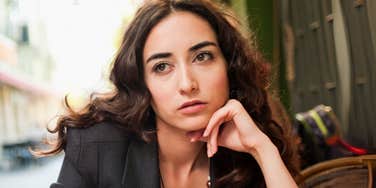 Woman telling herself dangerous lies to stay in the wrong relationship.