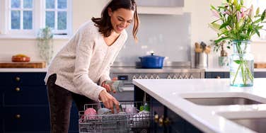 woman loading her dishwasher