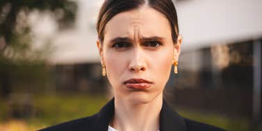 entitled adult woman with a pout on her face