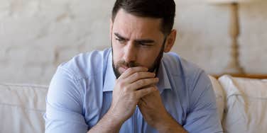 man wondering if he should skip his friends wedding because his girlfriend wasn't invited