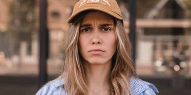 insufferable woman shrugging off responsibilities looking angry