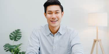 japanese man smiling at camera 