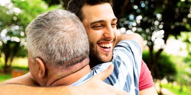 Expert hugging their parent.
