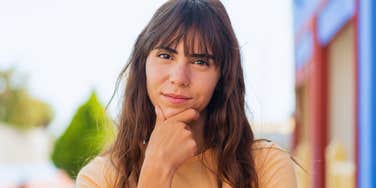 judgmental young woman thinking
