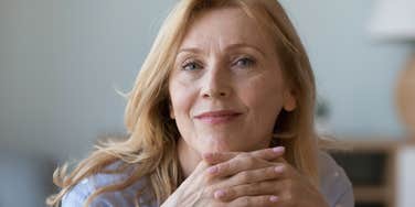 older woman smiling choosing peace over popularity