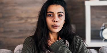 anxious woman recovering from socializing outside her home