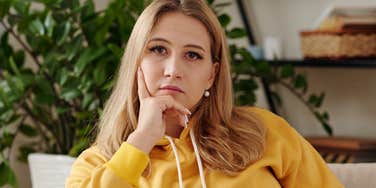 serious jealous woman staring ahead